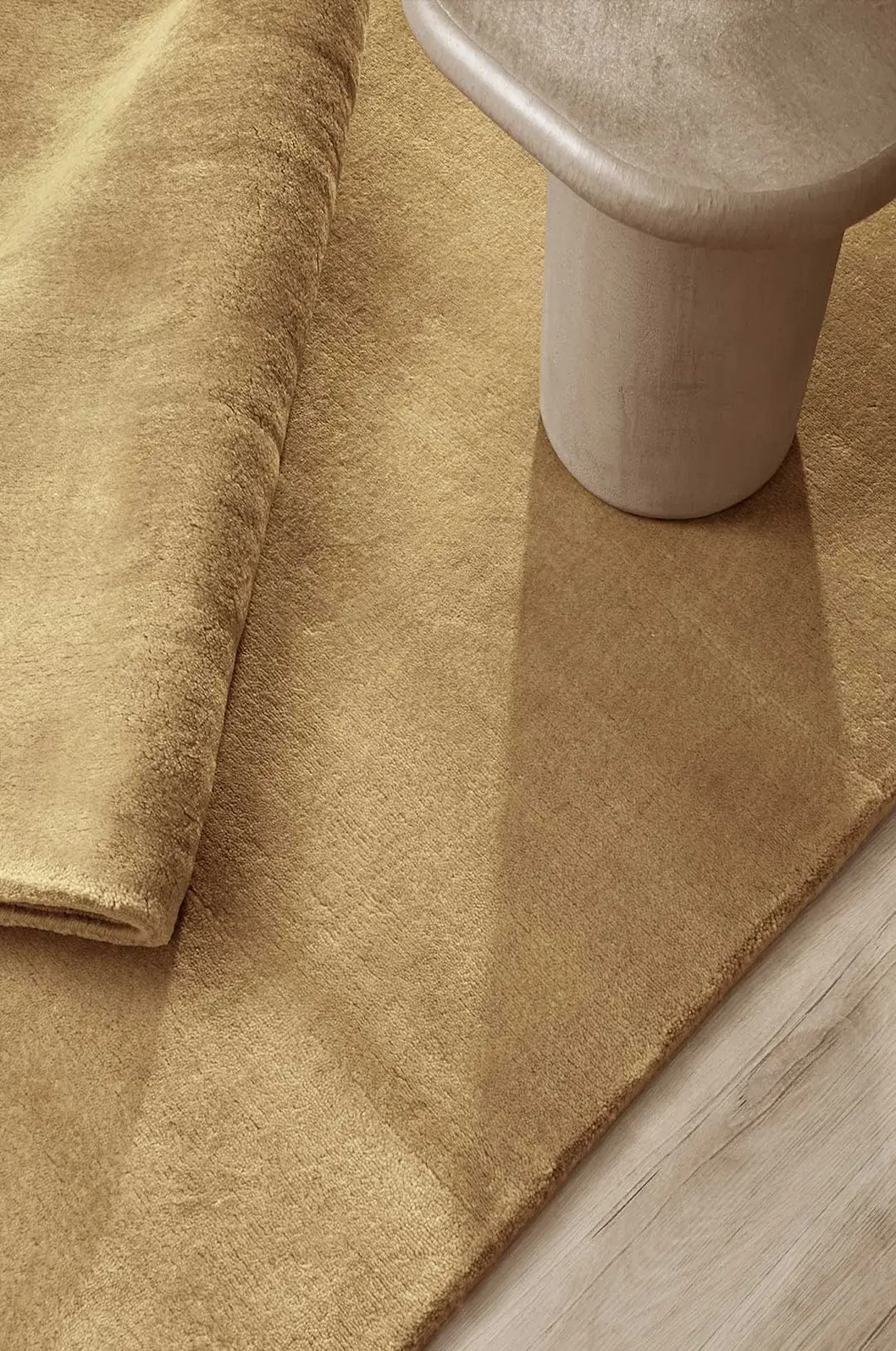 Kapetto Cashmere Caramel rug in a refined residential interior specified by an interior designer