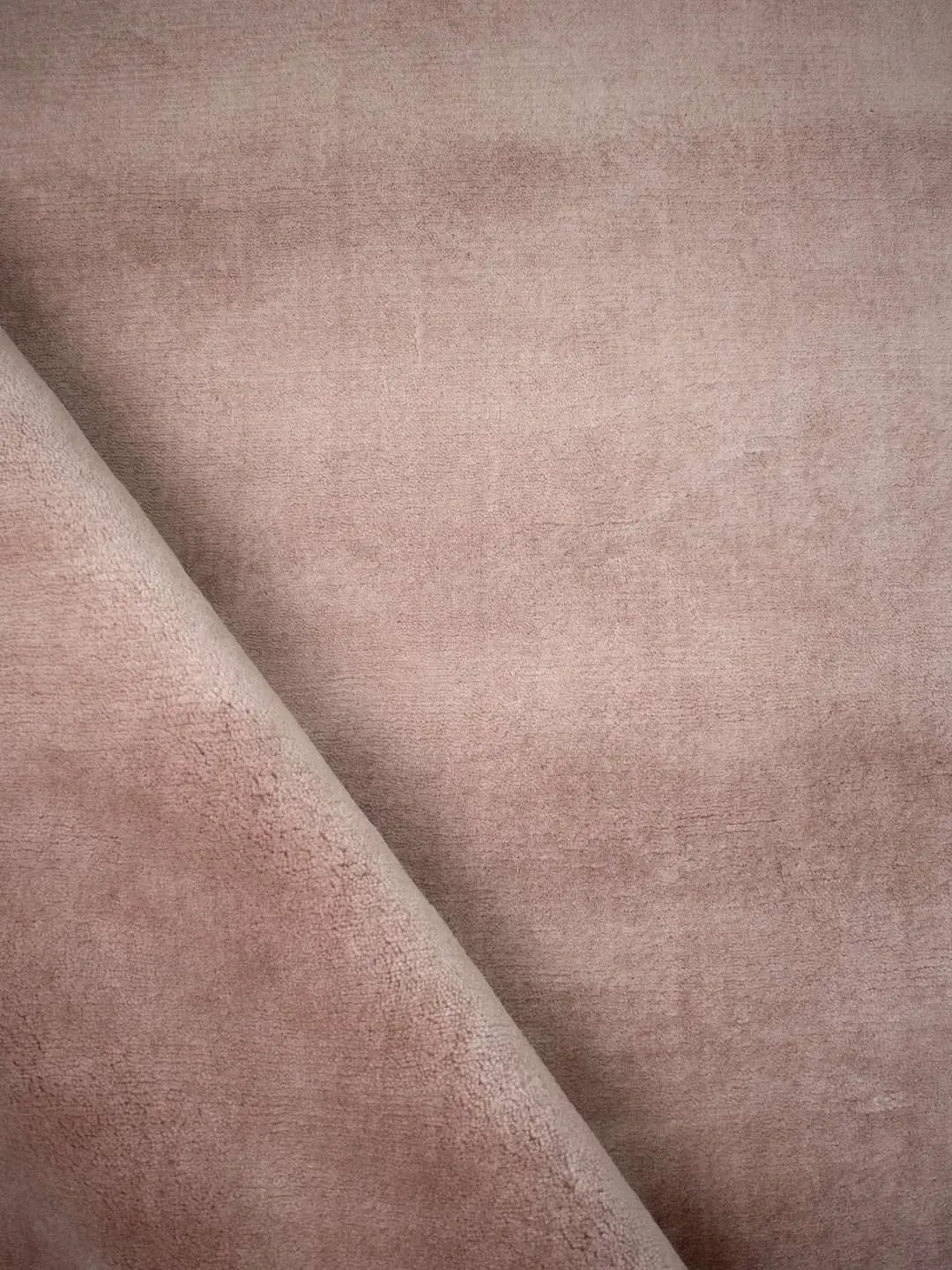 Cashmere Rose rug rolled showing pile