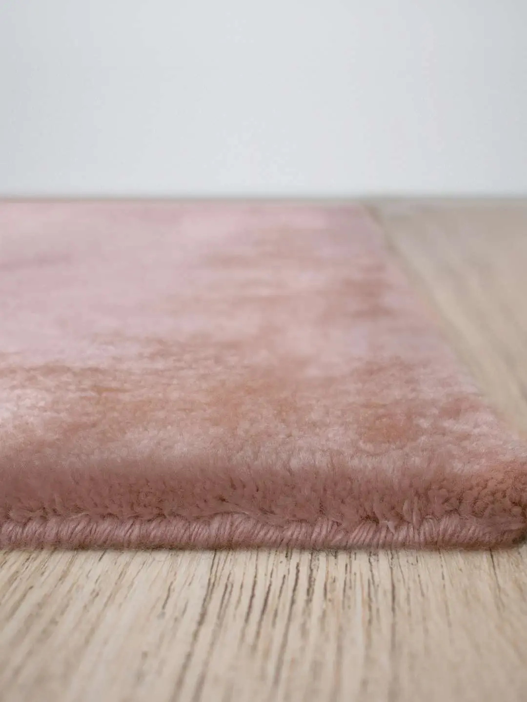 Cashmere Rose rug edge showing pile thickness