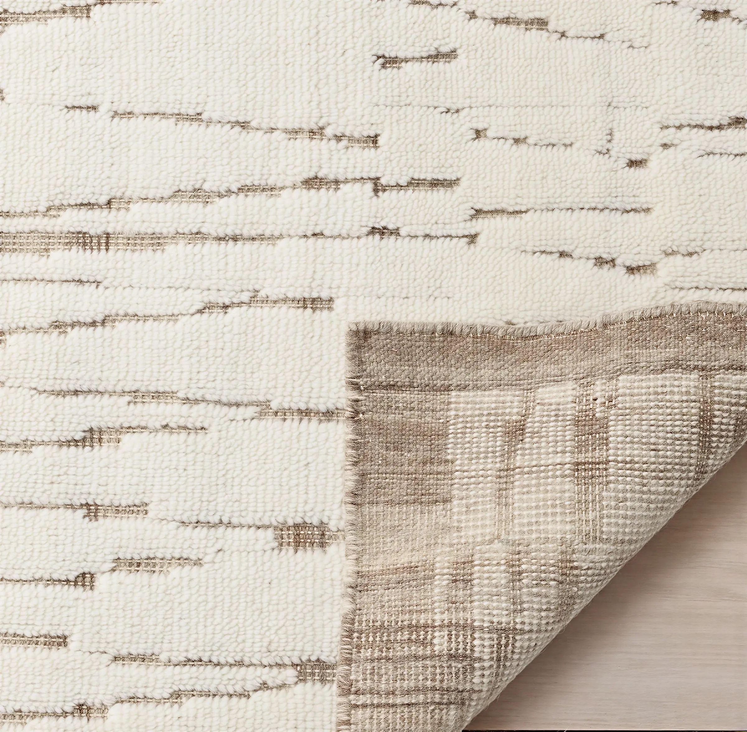 Kiri Hand-Knotted rug corner fold showing backing