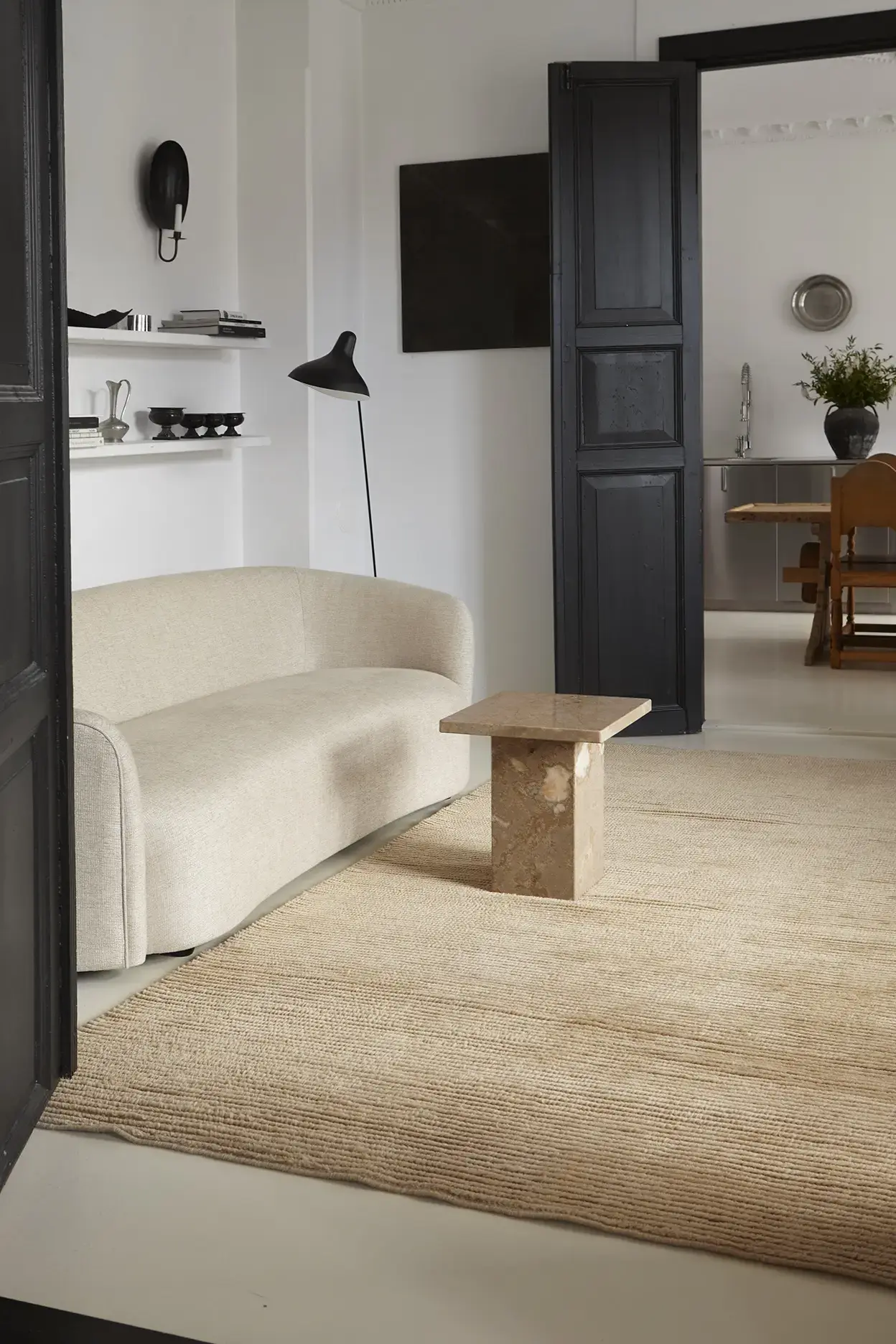 Nami Caramel rug in a styled living room with sofa and marble table