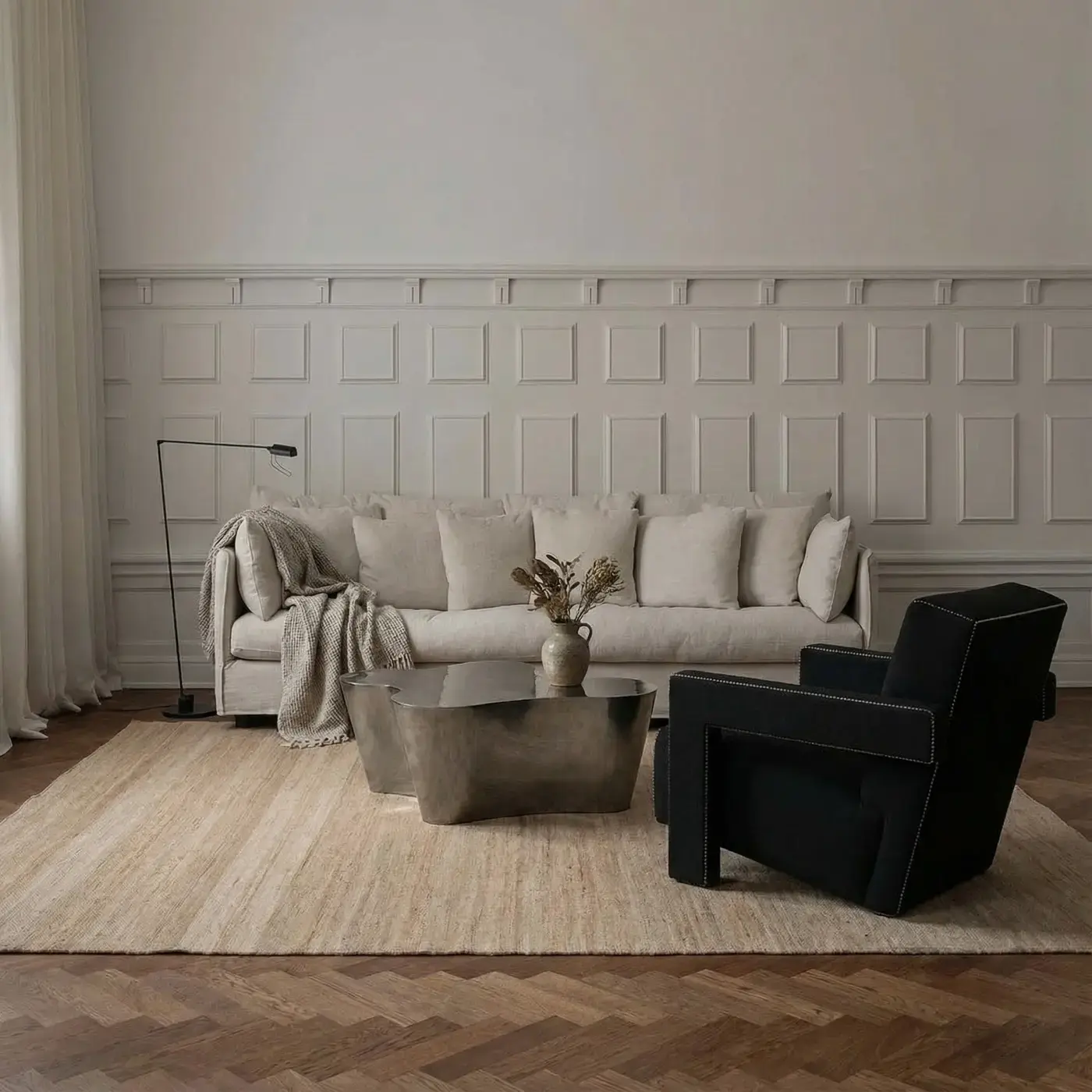 Sabi Natural jute rug in living room with paneled walls and linen sofa