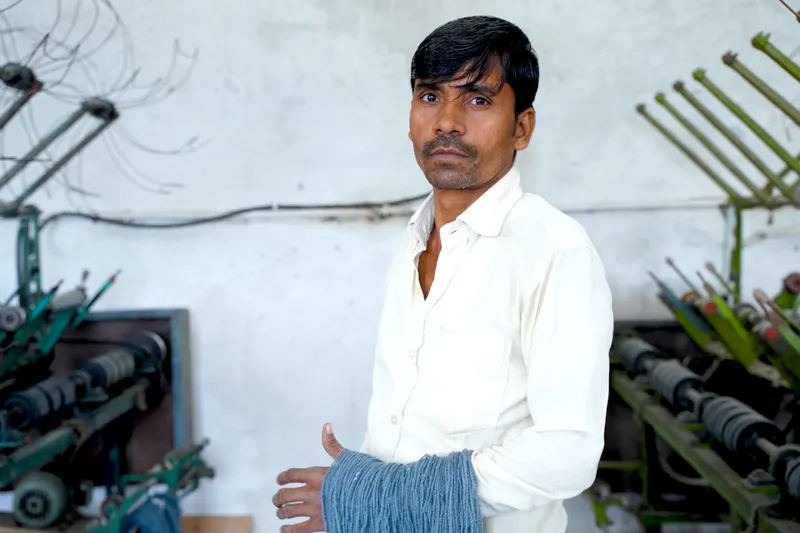 Anil Sharma working with natural dye plants in the dyeing workshop